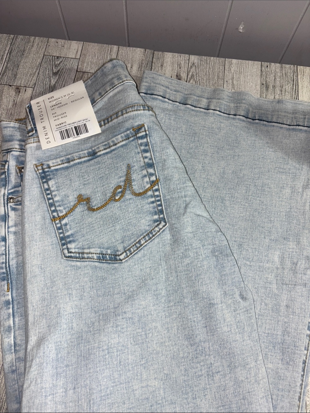 High-Rise Light Blue Women's Jeans with Gold Back-Pocket Script